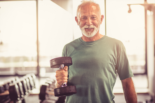 A man holding a dumbbell; training his strength even in old age!